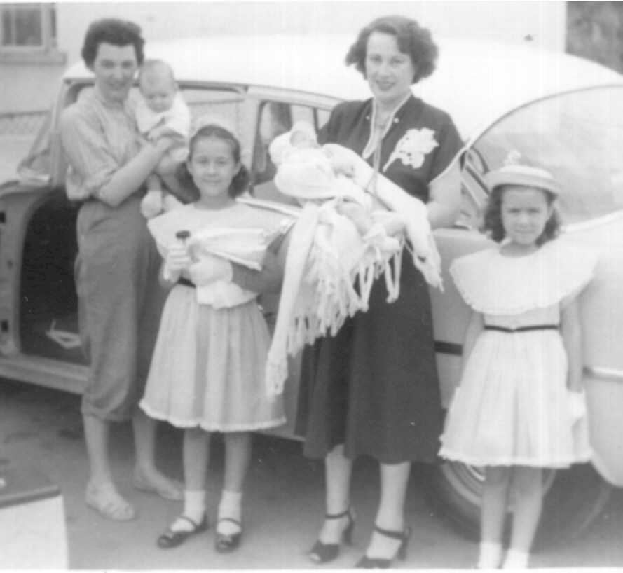 Jesse Whitsell Brown holding Bonnie Brown, Lucy, Bertha Brown Navas Ferrara holding George Ronald Ferrara III, Arlene Navas Brown, c. 1955