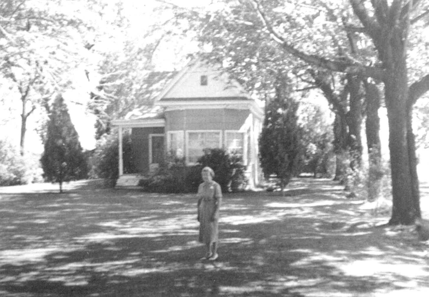 Home of Francis Adora Brown. Fannie Leona Brown Clark in front.