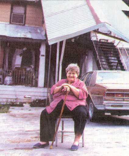 Berneil "Bea" Kummer sits in front of her Daley Canyon Lodge in 1992. 